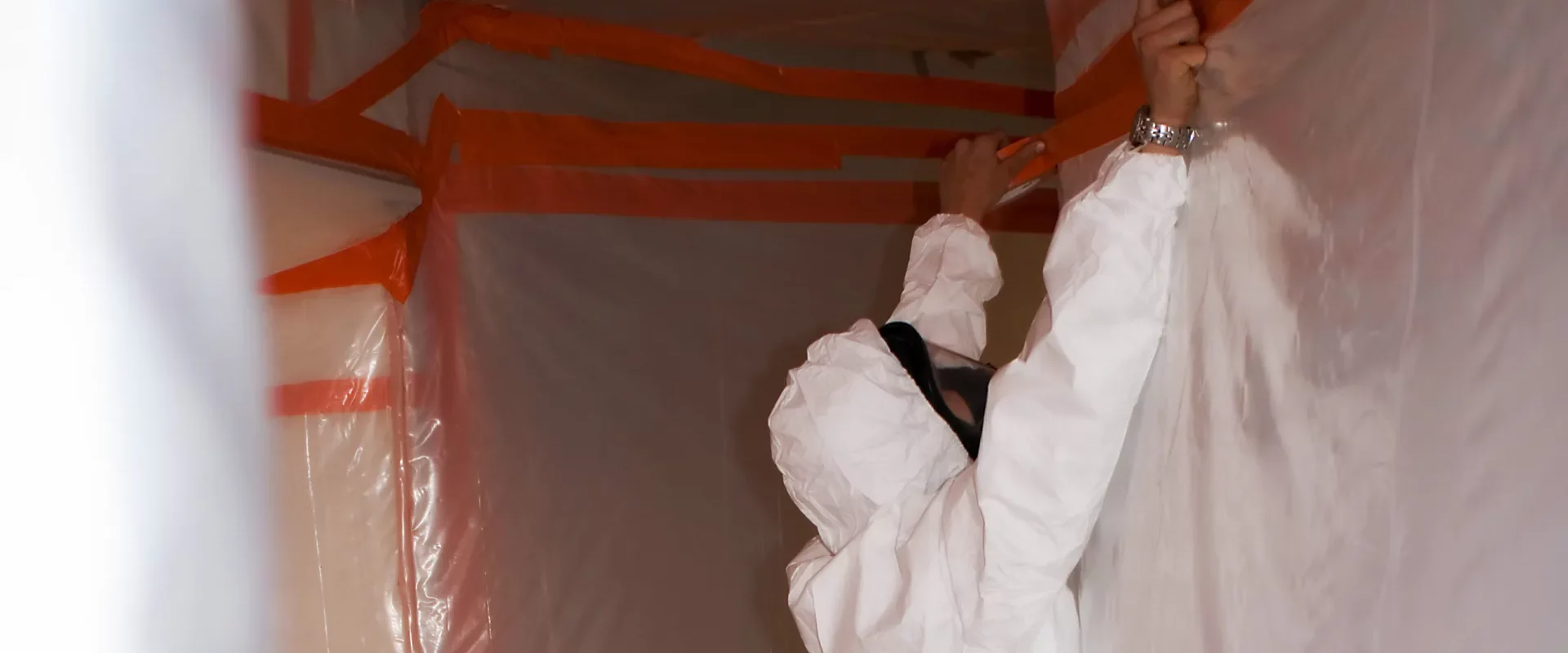 close up of an asbestos removal contractor preparing a house for asbestos removal parker co
